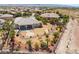 Aerial view of backyard featuring a stone walkway, palm trees, mature landscaping and fencing surrounding the property at 8536 Grand Palms Cir, Las Vegas, NV 89131