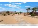 Professionally landscaped backyard with rock accents, desert plants, and a stone pathway, ideal for relaxation at 8536 Grand Palms Cir, Las Vegas, NV 89131