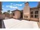 Beautiful backyard patio with an outdoor fireplace for relaxing or entertaining at 8536 Grand Palms Cir, Las Vegas, NV 89131