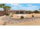 Spacious backyard featuring gravel and desert landscaping; perfect for outdoor enjoyment at 8536 Grand Palms Cir, Las Vegas, NV 89131