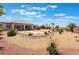 Large backyard with gravel, rocks, desert landscaping and patio at 8536 Grand Palms Cir, Las Vegas, NV 89131