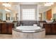 A luxurious bathroom features dual vanities, a soaking tub, and ample counter space at 8536 Grand Palms Cir, Las Vegas, NV 89131