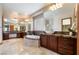 Bright bathroom features dual sinks, soaking tub, granite countertops, and a walk-in shower at 8536 Grand Palms Cir, Las Vegas, NV 89131