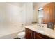 Bright bathroom featuring a tub and shower combination and single sink vanity at 8536 Grand Palms Cir, Las Vegas, NV 89131