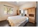 Cozy bedroom boasts hardwood floors and ample natural light from a bright window at 8536 Grand Palms Cir, Las Vegas, NV 89131