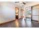 Hardwood bedroom offers ceiling fan, natural lighting and closet with mirrored doors at 8536 Grand Palms Cir, Las Vegas, NV 89131