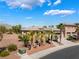 Well-maintained home exterior with desert landscaping, mature palm trees, and a paved driveway at 8536 Grand Palms Cir, Las Vegas, NV 89131