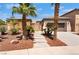Charming single-story home with desert landscaping, stone accents, and a welcoming entrance at 8536 Grand Palms Cir, Las Vegas, NV 89131