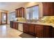 A well-lit kitchen features wood cabinets, stainless steel appliances, and a stylish backsplash at 8536 Grand Palms Cir, Las Vegas, NV 89131