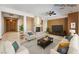 Living room enhanced by a stone fireplace, neutral tones, and ample open space at 8536 Grand Palms Cir, Las Vegas, NV 89131