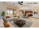 Virtually staged living room with open floor plan showcasing kitchen and dining area at 8536 Grand Palms Cir, Las Vegas, NV 89131