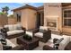 This home features a cozy outdoor patio with a fireplace and plenty of seating at 8536 Grand Palms Cir, Las Vegas, NV 89131