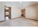 Spacious living area with tile flooring, neutral colors, and multiple entryways at 8536 Grand Palms Cir, Las Vegas, NV 89131