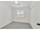 Cozy bedroom features neutral carpet, closet with sliding doors, and bright window at 8904 Meisenheimer Ave, Las Vegas, NV 89143