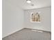 Bright bedroom with neutral carpet, and a window with a tree view at 8904 Meisenheimer Ave, Las Vegas, NV 89143
