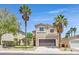 Charming two-story home with a well-maintained front yard and desert landscaping and tall palm trees at 8904 Meisenheimer Ave, Las Vegas, NV 89143