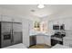 Bright kitchen featuring white cabinets, stainless steel appliances, and laminate countertops at 8904 Meisenheimer Ave, Las Vegas, NV 89143