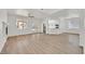 Spacious living room featuring neutral walls, wood-look floors, and natural light from the backyard at 8904 Meisenheimer Ave, Las Vegas, NV 89143