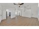 Expansive open living space with hard surface floors seamlessly connecting the living room and kitchen at 8904 Meisenheimer Ave, Las Vegas, NV 89143