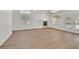 Bright and airy living room featuring a fireplace, light walls, and wide plank floors at 8904 Meisenheimer Ave, Las Vegas, NV 89143