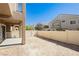 Backyard with a covered patio and fence, perfect for outdoor entertaining and relaxation at 10010 Aspen Rose St # 102, Las Vegas, NV 89183