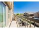 Open balcony offers stunning views of the community and meticulously landscaped green spaces at 10010 Aspen Rose St # 102, Las Vegas, NV 89183