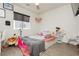 Charming bedroom featuring a window and wood flooring, creating a comfortable and inviting space at 10010 Aspen Rose St # 102, Las Vegas, NV 89183