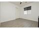 Clean bedroom with laminate flooring, a window with blinds, and a closet for ample storage at 10010 Aspen Rose St # 102, Las Vegas, NV 89183