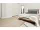 This bedroom features a neutral color scheme, closet, and modern bed frame for a relaxing retreat at 10010 Aspen Rose St # 102, Las Vegas, NV 89183