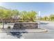 St Rose Court community sign with well-maintained landscaping and neighborhood entrance at 10010 Aspen Rose St # 102, Las Vegas, NV 89183