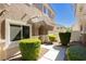 Charming home entrance featuring well-manicured landscaping, cozy front porch and a clearly visible house number at 10010 Aspen Rose St # 102, Las Vegas, NV 89183