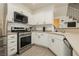 A chef's dream kitchen with ample countertop space and stainless steel appliances at 10010 Aspen Rose St # 102, Las Vegas, NV 89183