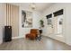 Bright living area featuring modern decor and French doors to the outdoors at 10010 Aspen Rose St # 102, Las Vegas, NV 89183