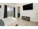 This bedroom features a private balcony and ensuite, offering a perfect blend of luxury and convenience at 10010 Aspen Rose St # 102, Las Vegas, NV 89183