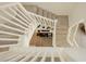 Staircase with white banister and carpet steps providing access to upper floors at 10010 Aspen Rose St # 102, Las Vegas, NV 89183