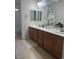 Bathroom with double sink vanity, large mirror, and shower with bath tub at 109 Delighted Ave, North Las Vegas, NV 89031