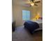 Cozy bedroom featuring carpet flooring, ceiling fan and natural light at 109 Delighted Ave, North Las Vegas, NV 89031