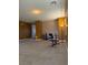 Large bonus room with carpet flooring, exercise equipment and a floor lamp at 109 Delighted Ave, North Las Vegas, NV 89031