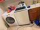 Bright laundry room with tile floor and modern washer and dryer appliances at 109 Delighted Ave, North Las Vegas, NV 89031