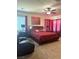 Main bedroom features neutral carpet, fan, and cherry-colored furniture at 109 Delighted Ave, North Las Vegas, NV 89031