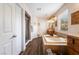 Spacious bathroom featuring a large soaking tub, dual vanities, separate shower and wood-look floors at 11285 Fiesole St, Las Vegas, NV 89141