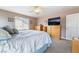 Bedroom with carpet, a queen bed, dresser and TV offers a calm, relaxing, neutral color at 11285 Fiesole St, Las Vegas, NV 89141