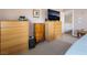 Bedroom with dressers and TV offers a calm, relaxing, neutral color with carpet at 11285 Fiesole St, Las Vegas, NV 89141