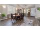 Inviting dining area with modern lighting, plantation shutters, and hardwood flooring at 11285 Fiesole St, Las Vegas, NV 89141