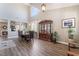 Bright dining room featuring wood floors, large windows, high ceilings and classic display cabinet at 11285 Fiesole St, Las Vegas, NV 89141