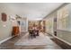 Inviting dining area with wood floors, stylish shutters, and seamless access to the kitchen at 11285 Fiesole St, Las Vegas, NV 89141