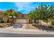 Well-maintained home with a tidy lawn, desert landscaping, and a spacious two-car garage at 11285 Fiesole St, Las Vegas, NV 89141
