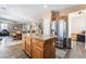 Well-designed kitchen with a granite island, stainless steel appliances, and seamless living room integration at 11285 Fiesole St, Las Vegas, NV 89141