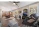 Open-concept living room featuring a fireplace, dining area, and modern massage chair for ultimate relaxation at 11285 Fiesole St, Las Vegas, NV 89141