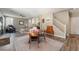 Spacious living room with an open layout, seamlessly connecting the dining area and staircase at 11285 Fiesole St, Las Vegas, NV 89141